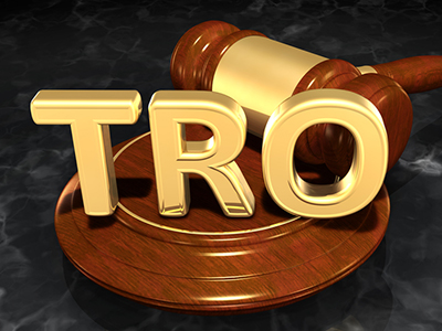Temporary Restraining Order acronoym in front of gavel image Courts Still Heavily Favor Rule 65 TROs Over DTSA Ex Parte Seizures